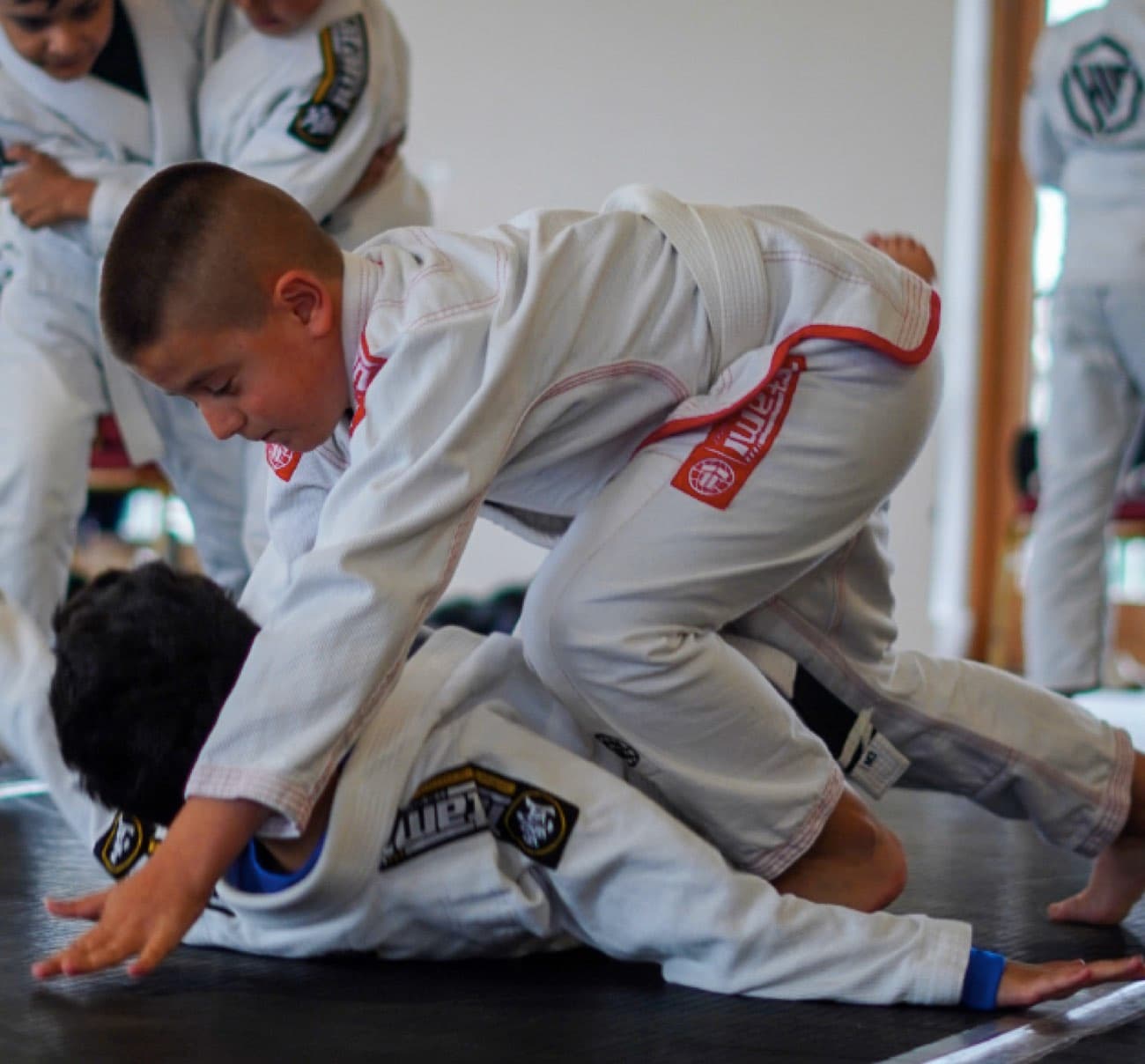 Children training Brazilian Jiu-Jitsu at Khalid Ismail Academy